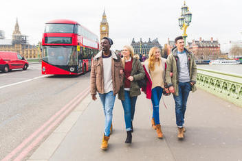 Students walking on a London bridge