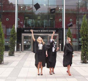Students throwing hats