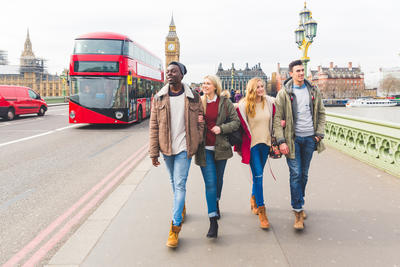 Students walking on a London bridge